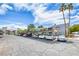 Apartment complex parking lot with palm trees and covered parking at 5199 Caliente St # 63, Las Vegas, NV 89119