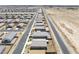 Overhead view of the residential street lined with modern single-Gathering homes in a neighborhood near the desert landscape at 5360 S Chippewa St, Pahrump, NV 89061