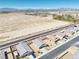An aerial view of the neighborhood showcasing the single-Gathering homes and desert landscape with mountain views at 5360 S Chippewa St, Pahrump, NV 89061