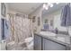Bathroom featuring a vanity with granite countertop and a shower with curtain at 5360 S Chippewa St, Pahrump, NV 89061