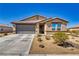 Charming single-story home with a well-maintained yard and a two-car garage at 5360 S Chippewa St, Pahrump, NV 89061
