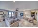 Bright living room featuring tile floors, modern furniture, and large windows at 5360 S Chippewa St, Pahrump, NV 89061