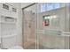 Updated bathroom features glass enclosed shower, tiled walls, and modern lighting at 6116 Golden Saddle St, Las Vegas, NV 89130