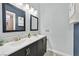 Bathroom with double sink vanity, tile flooring, and modern fixtures at 6116 Golden Saddle St, Las Vegas, NV 89130