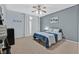 Comfortable bedroom with ample natural light, ceiling fan, and neutral color scheme at 6116 Golden Saddle St, Las Vegas, NV 89130