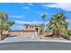 Stunning two-story home with well-manicured landscaping and a spacious three-car garage at 6116 Golden Saddle St, Las Vegas, NV 89130