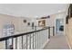 Open hallway with chandelier and views of the staircase and front door at 6116 Golden Saddle St, Las Vegas, NV 89130