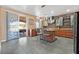 Well-equipped kitchen with granite counters, stainless appliances, and access to an outdoor dining area at 6116 Golden Saddle St, Las Vegas, NV 89130