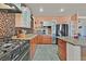 Stylish kitchen featuring stainless steel appliances, granite countertops, and ample cabinet space at 6116 Golden Saddle St, Las Vegas, NV 89130