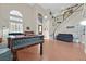 Spacious living room featuring high ceilings, ample natural light, and an elegant staircase at 6116 Golden Saddle St, Las Vegas, NV 89130