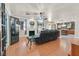 Inviting living room with fireplace, wood floors, and seamless access to the kitchen at 6116 Golden Saddle St, Las Vegas, NV 89130