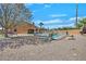 Home featuring pool, gravel landscaping and desert foliage at 6116 Golden Saddle St, Las Vegas, NV 89130