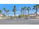 Neighborhood street scene showcasing the community's landscaping and homes at 6116 Golden Saddle St, Las Vegas, NV 89130