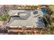 Aerial view of house with solar panels, tile roof, and private backyard with pool and spa at 6907 May Basket Ave, Las Vegas, NV 89131