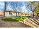 Spacious backyard featuring an artificial lawn and mature trees at 6907 May Basket Ave, Las Vegas, NV 89131