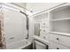 Bathroom featuring white cabinets, and a shower with adjustable shower head at 6907 May Basket Ave, Las Vegas, NV 89131