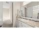 Bathroom with granite counters, large mirror and access to additional rooms at 6907 May Basket Ave, Las Vegas, NV 89131