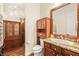 Bathroom featuring wood cabinets and drawers and glass-enclosed shower at 6907 May Basket Ave, Las Vegas, NV 89131