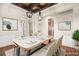 Elegant dining room with stylish light fixtures, decor, and artwork at 6907 May Basket Ave, Las Vegas, NV 89131