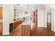 Modern kitchen features a large island, stainless steel appliances and access to the living area and dining room at 6907 May Basket Ave, Las Vegas, NV 89131