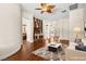Inviting living room with modern decor, stylish area rug, and hardwood flooring at 6907 May Basket Ave, Las Vegas, NV 89131