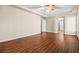 Large main bedroom features hardwood floors, tray ceiling and multiple doors to other areas of the house at 6907 May Basket Ave, Las Vegas, NV 89131