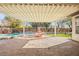 Spacious patio with pergola overlooking pool with rock waterfall feature and fountain at 6907 May Basket Ave, Las Vegas, NV 89131