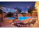 Inviting backyard pool and spa, complete with a waterfall feature and charming poolside cabana, perfect for relaxing evenings at 6907 May Basket Ave, Las Vegas, NV 89131