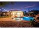 Inviting backyard pool and spa, complete with a waterfall feature and charming poolside cabana, perfect for relaxing evenings at 6907 May Basket Ave, Las Vegas, NV 89131
