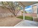 Private backyard oasis featuring a covered patio, xeriscaping, and artificial grass at 8065 Starling View Ct, Las Vegas, NV 89166