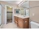 Bathroom features double sinks, tiled floors and walk-in closet access at 8065 Starling View Ct, Las Vegas, NV 89166