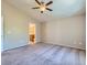 Neutral bedroom features ceiling fan, carpeted floor and adjoining bathroom at 8065 Starling View Ct, Las Vegas, NV 89166