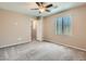 Bedroom features ceiling fan, carpet floor and ensuite bath access at 8065 Starling View Ct, Las Vegas, NV 89166
