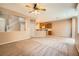 Spacious living room view highlighting the staircase, kitchen, and open layout at 8065 Starling View Ct, Las Vegas, NV 89166