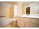A bright bathroom featuring a vanity, sink, mirror, a tub, and a shower at 8160 Autumn Star Ave, Las Vegas, NV 89145