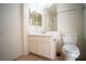 A bright bathroom featuring a vanity, sink, mirror, and toilet at 8160 Autumn Star Ave, Las Vegas, NV 89145