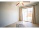 Bedroom with sliding glass door to backyard and neutral finishes at 8160 Autumn Star Ave, Las Vegas, NV 89145