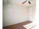 A bright bedroom with plush carpet, a ceiling fan, and lots of natural light at 8160 Autumn Star Ave, Las Vegas, NV 89145