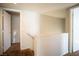 A bright upstairs hallway leading to bedrooms with neutral walls and plush carpet at 8160 Autumn Star Ave, Las Vegas, NV 89145