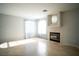 Living room with tile flooring features a fireplace and natural light at 8160 Autumn Star Ave, Las Vegas, NV 89145