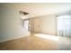 Open-concept room with tile flooring, staircase, and entry door at 8160 Autumn Star Ave, Las Vegas, NV 89145
