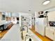 Bright kitchen with a large sink, white cabinets, and a view into a comfortable living area, perfect for gatherings at 8233 Hydra Ln, Las Vegas, NV 89128
