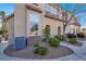 Well-maintained exterior with landscaped grounds and a stone accent wall at 8426 Sluman Ct, Las Vegas, NV 89128