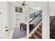 Welcoming foyer with an upright piano, staircase, and a view to living area at 8426 Sluman Ct, Las Vegas, NV 89128