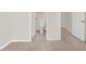 Hallway leads to a water closet featuring a toilet and a door into another room at 8426 Sluman Ct, Las Vegas, NV 89128