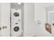Convenient in-unit laundry area with a stacked washer and dryer at 8426 Sluman Ct, Las Vegas, NV 89128