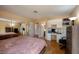 Spacious bedroom boasts wood floors, mirrored closet, and a built-in workstation, offering comfort and functionality at 8582 Manalang Rd, Las Vegas, NV 89123