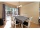 Bright dining area featuring a sliding glass door to the backyard and stylish pendant lighting at 8582 Manalang Rd, Las Vegas, NV 89123