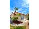 Beautiful exterior view showcasing a terracotta tiled roof, complemented by tropical palm trees at 8582 Manalang Rd, Las Vegas, NV 89123