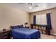 Comfortable bedroom featuring a ceiling fan, record player, dark furniture and a cozy vibe at 8600 W Charleston Blvd # 2190, Las Vegas, NV 89117